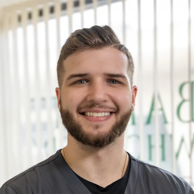 A headshot of Dr. Nicholas Depretis, a chiropractor at Depretis Chiropractic & Total Wellness.