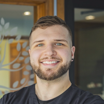 A headshot of Dr. Nicholas Depretis, a chiropractor at Depretis Chiropractic & Total Wellness.